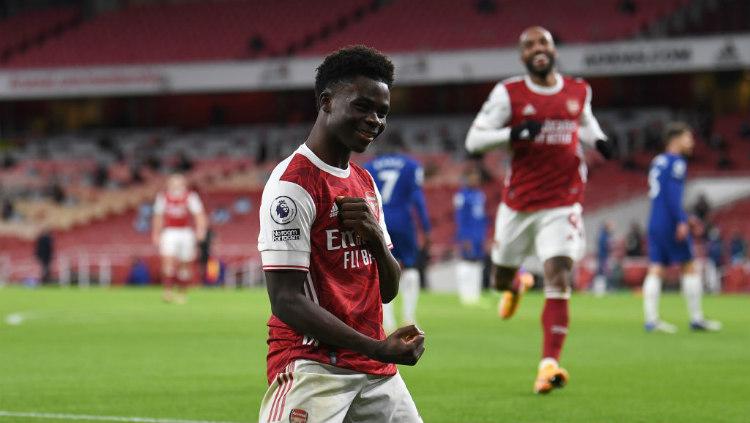 Selebrasi gol Bukayo Saka di laga Arsenal vs Chelsea.