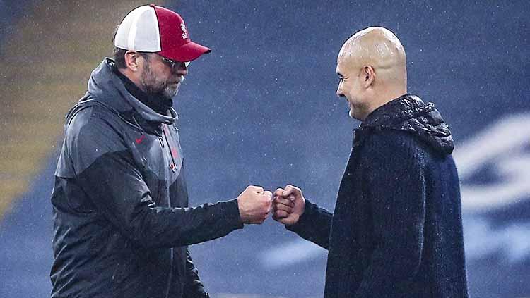 Jurgen Klopp dan Pep Guardiola. Copyright: Martin Rickett/PA Images via Getty Images