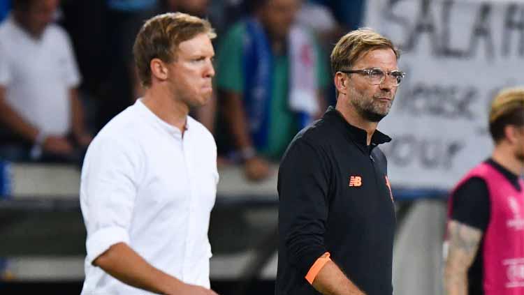 Julian Nagelsmann dan Jurgen Klopp. Copyright: Uwe Anspach/picture alliance via Getty Images