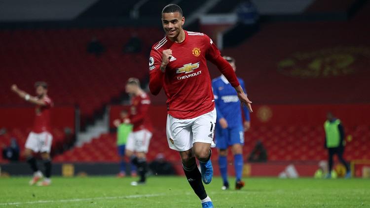 Mason Greenwood merayakan gol penentu kemenangan timnya pada laga pekan ke-31 Liga Inggris antara Manchester United vs Brighton. - INDOSPORT