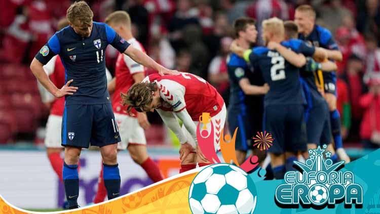 Rasmus Schuller sedang mencoba menghibur Mathias Jensen yang menggantikan Christian Eriksen dalam laga Euro 2020 Denmark vs Finlandia. Copyright: Martin Meissner - Pool/Getty Images