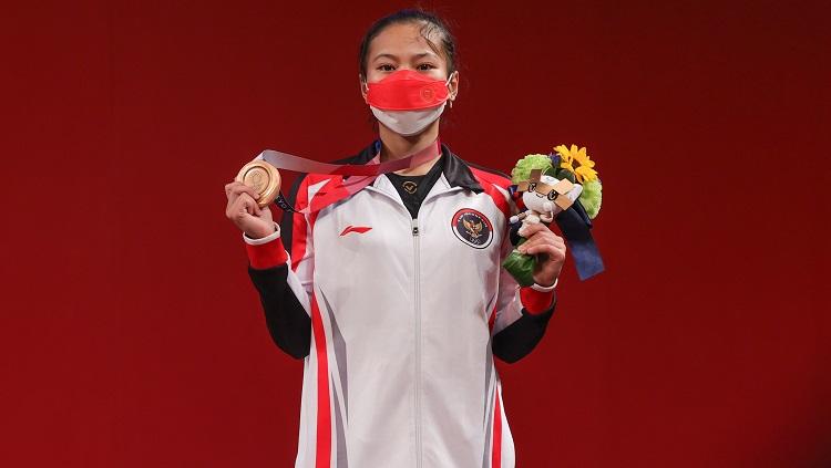 Lifter putri Indonesia, Windy Cantika sukses merebut medali perunggu di Olimpiade Tokyo 2020, Sabtu (24/07/21). - INDOSPORT