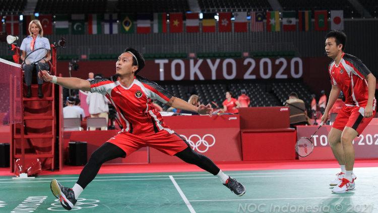 Hendra Setiawan/Mohammad Ahsan berhasil mengalahkan wakil Malaysia, Aaron Chia/Wooi Yik Soh di pertandingan kedua penyisihan Grup B Olimpiade Tokyo 2020.