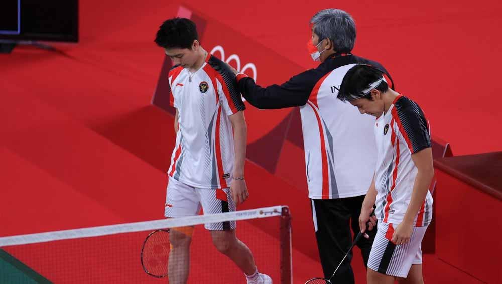 Marcus Gideon/Kevin Sanjaya usai kalah di 8 besar Olimpiade 2020.