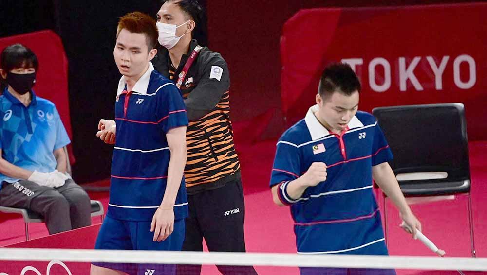 Selebrasi Aaron Chia/Soh Wooi Yik usai kalahkan Marcus/Kevin di Olimpiade Tokyo 2020.