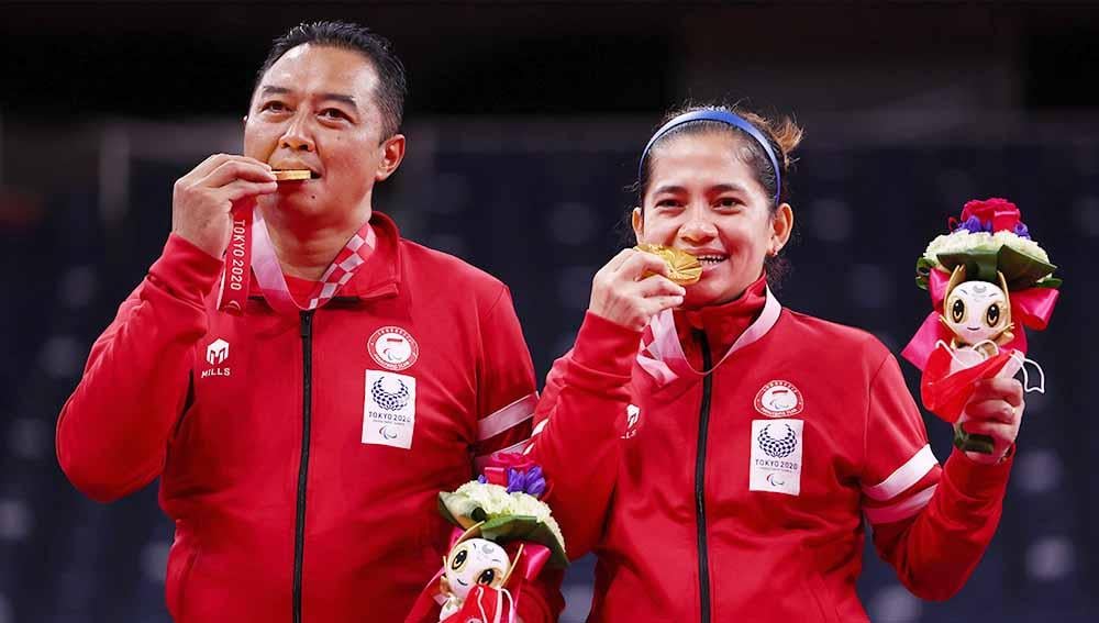 Tampil gemilang, pebulutangkis ganda campuran Hary Susanto/Leani Ratri Oktila persembahkan medali emas untuk Indonesia di Paralimpiade Tokyo 2020. - INDOSPORT