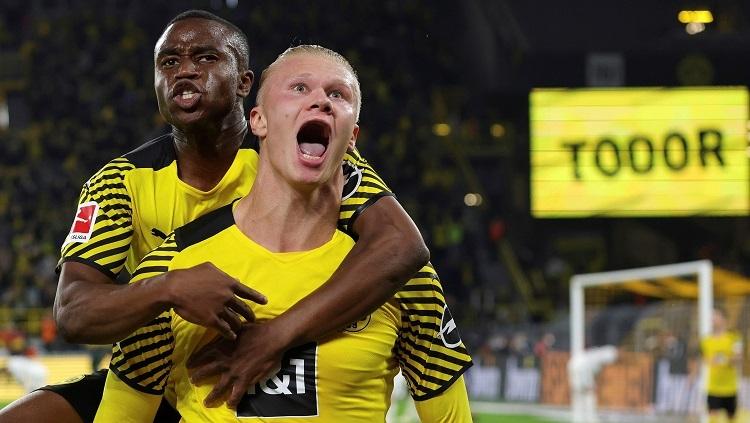Borussia Dortmund, Erling Haaland, merayakan gol kemenangan ke gawang Bayer Leverkusen pada laga pekan keempat Bundesliga Jerman, Sabtu (11/09/21). - INDOSPORT