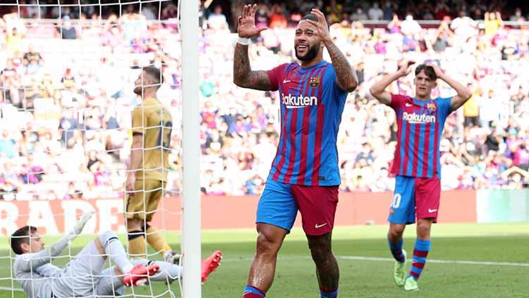 Aksi Memphis Depay di laga Barcelona vs Levante dalam lanjutan laLiga. - INDOSPORT