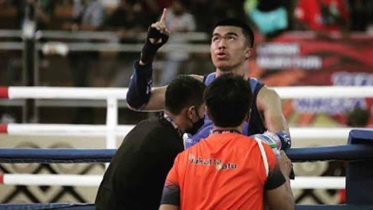Indosport - Muhhamad Uchida Sudirman berhasil raih emas Muaythai PON XX Papua.