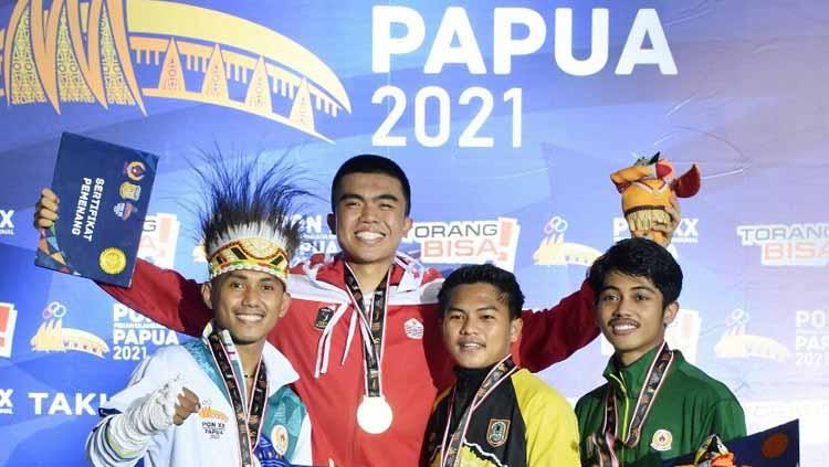 Pemain muda Persija Jakarta, Uchida Sudirman berhasil meraih prestasi di PON XX Papua, dengan mendapatkan dua medali untuk DKI Jakarta di cabor muaythai. - INDOSPORT