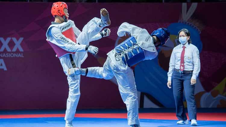 Taekwondo Jawa Barat saat berduel di PON Papua. - INDOSPORT