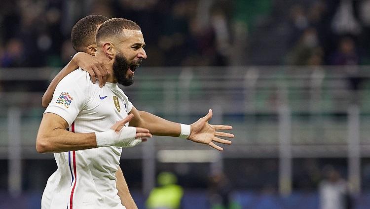 Selebrasi Karim Benzema usai mencetak gol untuk Prancis dalam pertandingan final UEFA Nations Leagua 2021, Minggu (10/10/21). - INDOSPORT