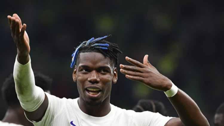 Gelandang internasional Prancis, Paul Pogba, menunjukkan dukungan untuk negara orangtuanya yakni Guinea yang berlaga di Piala Afrika 2021. - INDOSPORT