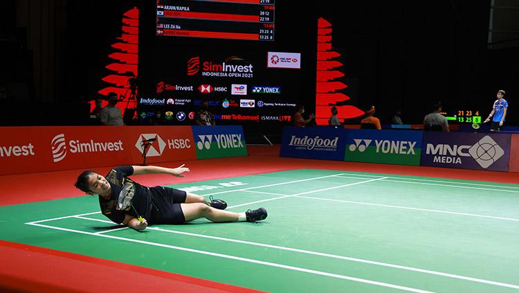 Gregoria Mariska Tunjung terjatuh dan berhasil lolos ke babak kedua Indonesia Open 2021