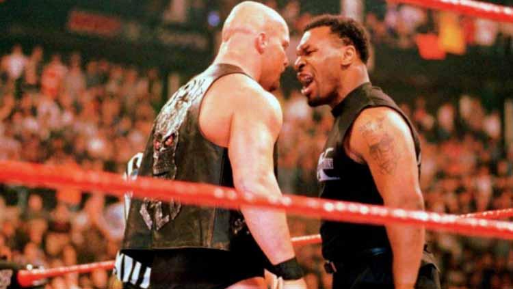 Bintang WWE, Bobby Lashley, mengungkapkan bahwa ia kemungkinan akan melakukan pertandingan tinju tangan kosong dengan petinju legendaris, Mike Tyson. - INDOSPORT