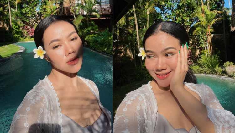 Penyanyi bersuara emas, Yura Yunita, terlihat serius menggeluti olahraga yoga, namun netizen yang terpukau dengan aksinya, justru banyak yang salah fokus. - INDOSPORT