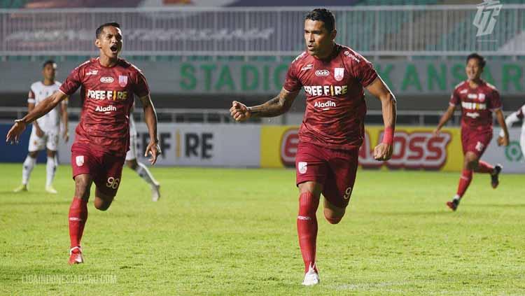 Beto Goncalves melakukan selebrasi usai membobol gawang Sriwijaya FC - INDOSPORT