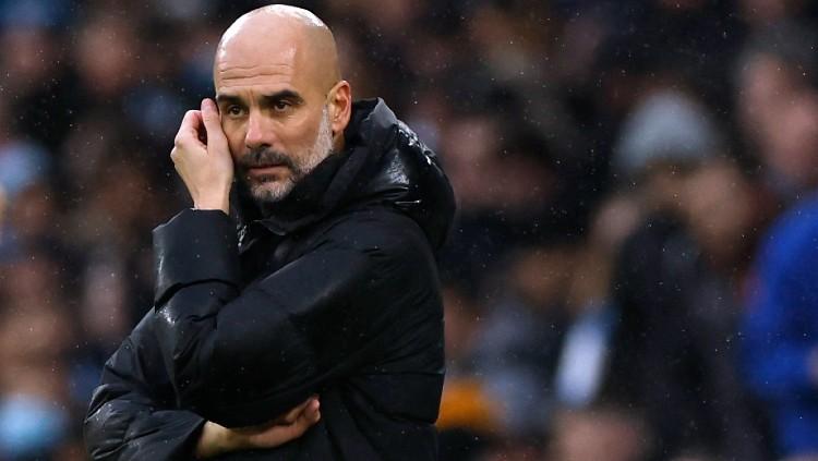Jelang pertandingan Grup G Liga Champions 2022/23, antara Sevilla vs Manchester City, Pep Guardiola dipusingkan dengan cedera yang dialami oleh keduanya. (Foto: Reuters/Jason Cairnduff)