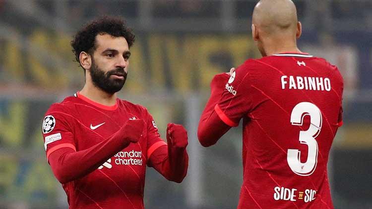 Mohamed Salah dan Fabinho di laga Inter Milan vs Liverpool pada babak 16 besar Liga Champions 2021/2022. Foto: REUTERS/Alessandro Garofalo. - INDOSPORT