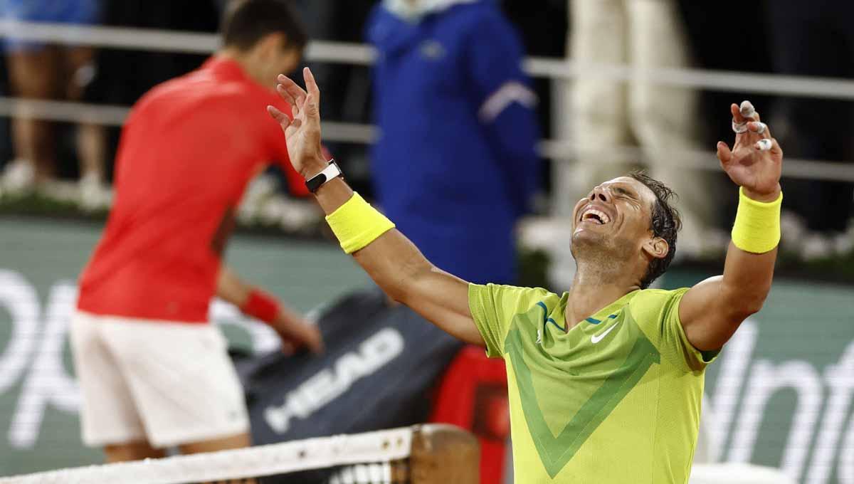 Petenis asal Spanyol, Rafael Nadal, mempertajam rekor dengan meraih dua gelar Grand Slam pada musim 2022, lalu bagaimana dengan nasib Novak Djokovic? Foto: REUTERS-Yves Herman - INDOSPORT
