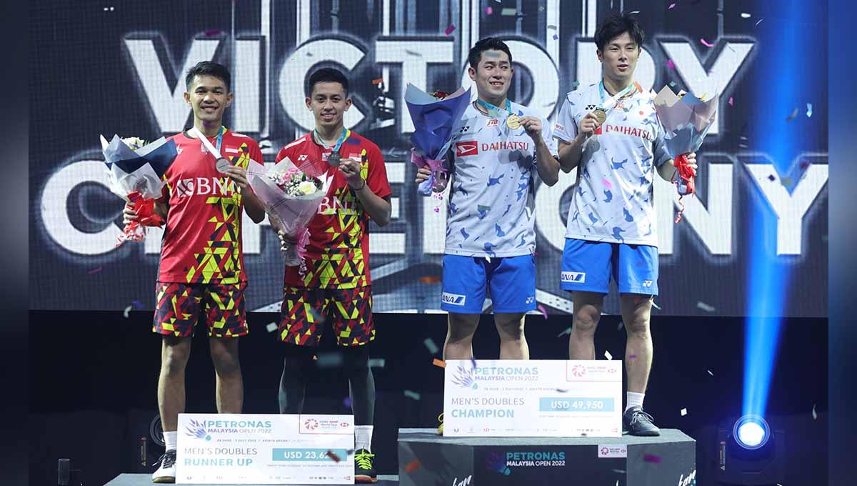 Perolehan poin smentara BWF World Tour Final setelah Malaysia Open 2022, di mana ganda putra Indonesia, Fajar Alfian/Muhammad Rian Ardianto senyum manis. Foto: PBSI