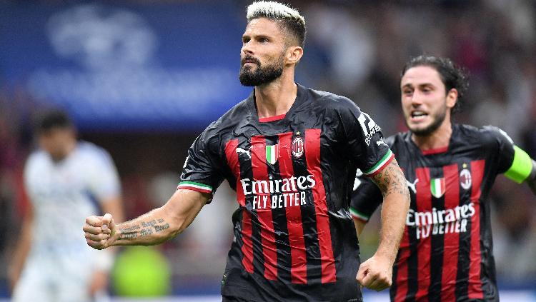 Pemain AC Milan Olivier Giroud merayakan gol pertama di Liga Champions REUTERS-Daniele Mascolo - INDOSPORT