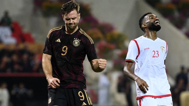 Selebrasi penyerang Timnas Jerman, Niclas Fullkrug (kiri), pasca mencetak gol ke gawang Oman (17/11/22). (Foto: REUTERS/Annegret Hilse) - INDOSPORT