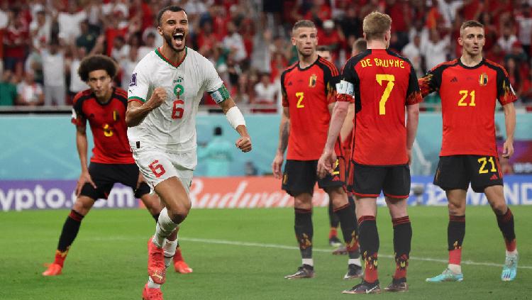 Romain Saiss dari Maroko merayakan gol pertama mereka yang dicetak Abdelhamid Sabiri. REUTERS-Amr Abdallah Dalsh - INDOSPORT