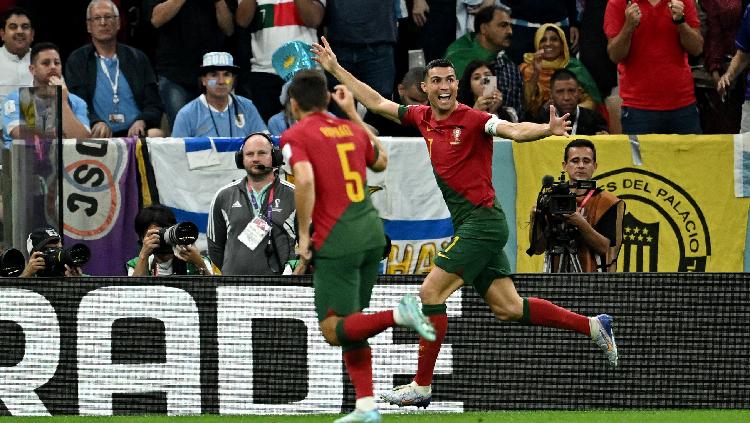 Cristiano Ronaldo Portugal merayakan gol pertama kontra Uruguay di Piala Dunia 2022 REUTERS-Dylan Martinez - INDOSPORT