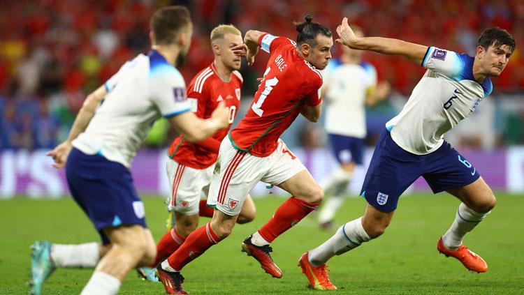 Harry Maguire sempat berubah jadi versi terburuknya di Manchester United usai lakukan aksi kocak di pertandingan Piala Dunia 2022 antara Wales vs Inggris. (Foto: REUTERS/Hannah Mckay).