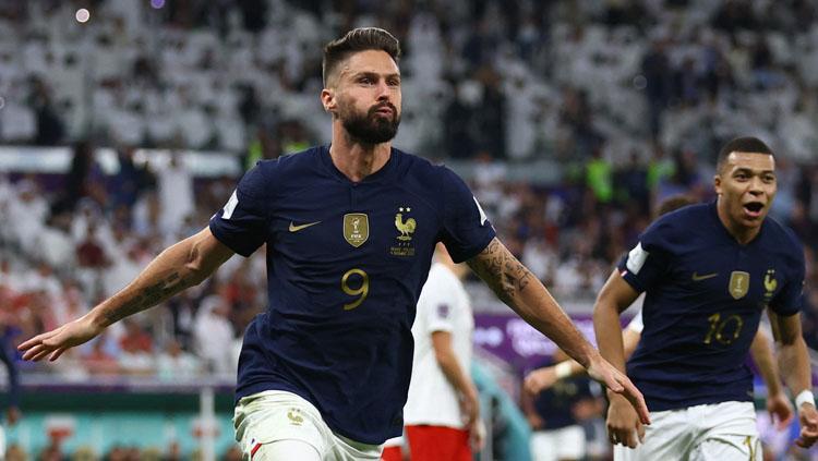 Selebrasi Striker Timnas Prancis, Olivier Giroud usai cetak gol ke gawang Polandia dalam laga babak 16 besar Piala Dunia 2022 (Foto: REUTERS/Hannah Mckay). - INDOSPORT
