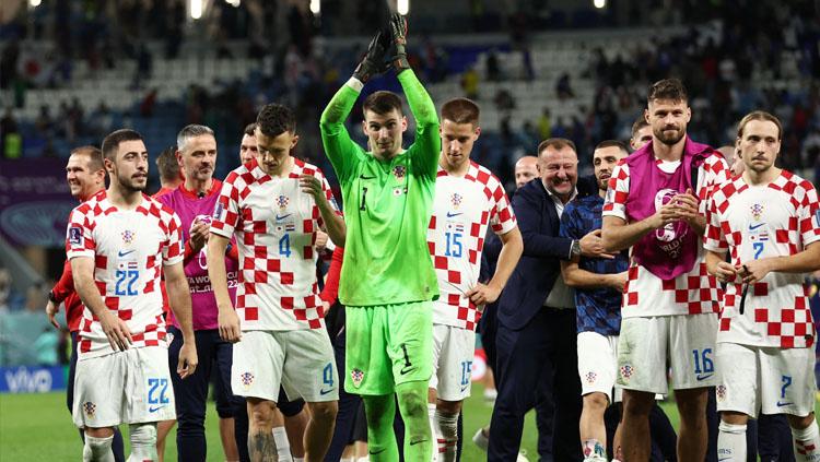 Selebrasi pemain Kroasia usai menang atas Jepang di babak 16 besar Piala Dunia 2022 lewat adu penalti (Foto: REUTERS/Marko Djurica). - INDOSPORT