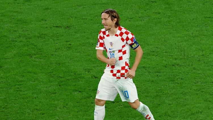 Ekspresi kapten Timnas Kroasia, Luka Modric usai menang atas Brasil di babak perempatfinal Piala Dunia 2022 (Foto: REUTERS/Lee Smith).