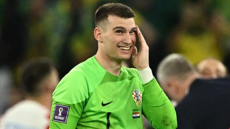 Tampil menawan kontra Brasil di 8 besar Piala Dunia 2022, kiper Kroasia, Dominic Livakovic, ternyata pernah diincar sejumlah klub Liga Italia (Serie A). - INDOSPORT