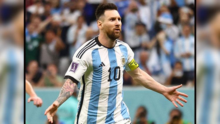 Selebrasi dari pemain megabintang sekaligus kapten Timnas Argentina, Lionel Messi usai jebol gawang Belanda di Perempatfinal Piala Dunia 2022 (Foto: REUTERS/Carl Recine). Copyright: REUTERS/Carl Recine