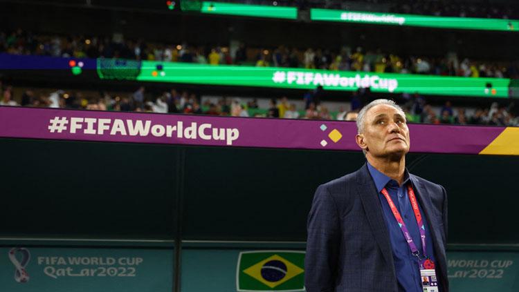 Pelatih Timnas Brasil, Tite mengundurkan diri usai dikalahkan Kroasia dalam pertandingan babak perempatfinal Piala Dunia 2022 (Foto: REUTERS/Hannah Mckay). - INDOSPORT
