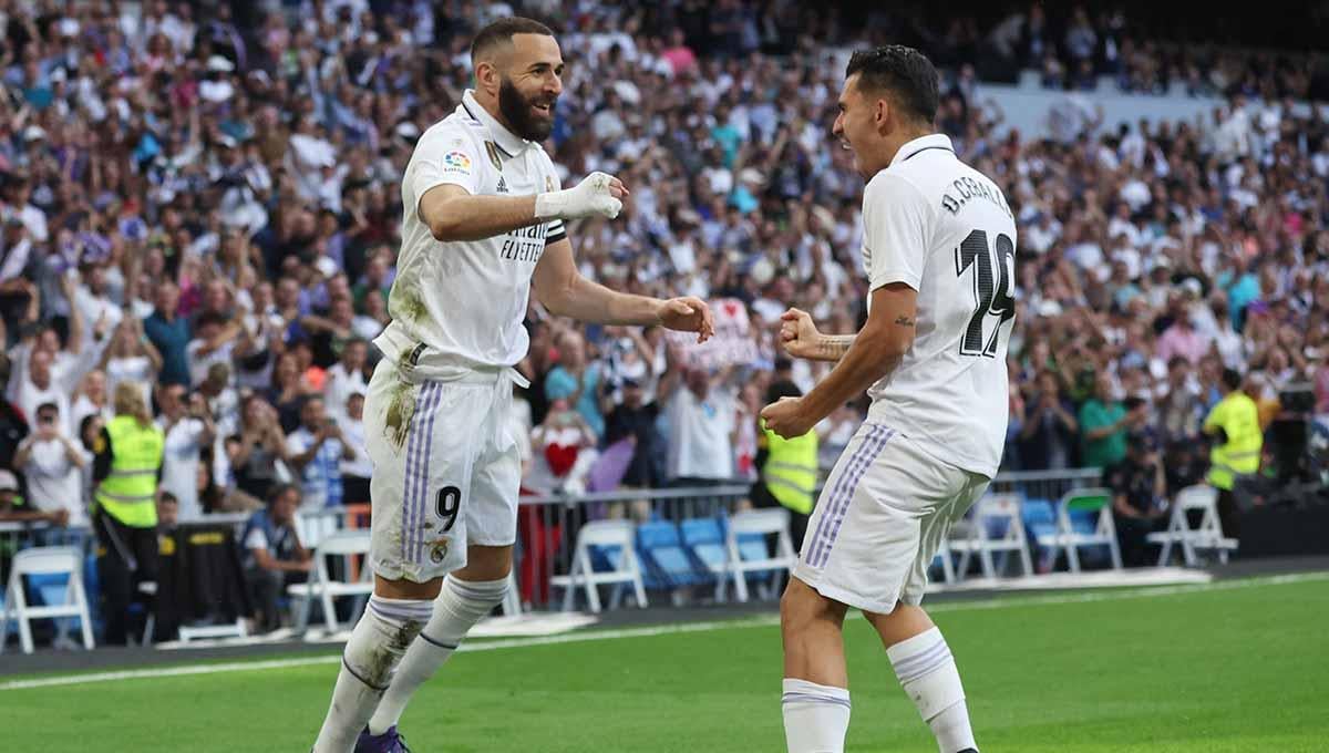 Gelanda Real Madrid Dani Ceballos dan Karim Benzema merayakan gol. (Foto: REUTERS/Isabel Infantes) - INDOSPORT