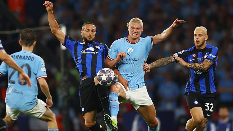 Manchester City merengkuh trofi Liga Champions pertama mereka usai mengalahkan Inter Milan 1-0 di Ataturk Olympic Stadium, Minggu (11/06/23) dini hari WIB. - INDOSPORT