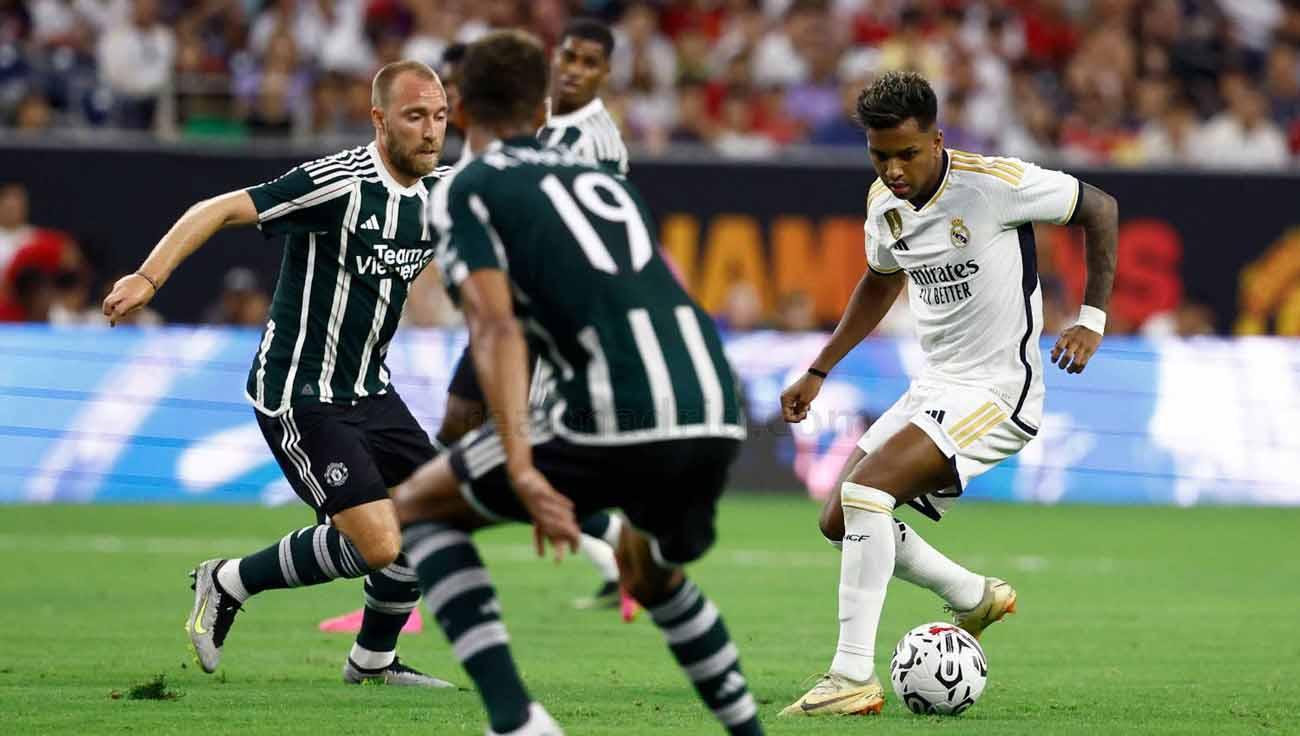 Pemain Real Madrid, Rodrygo mendapat kawalan pemain Manchester United Christian Eriksen di laga pramusim. (Foto: realmadrid)