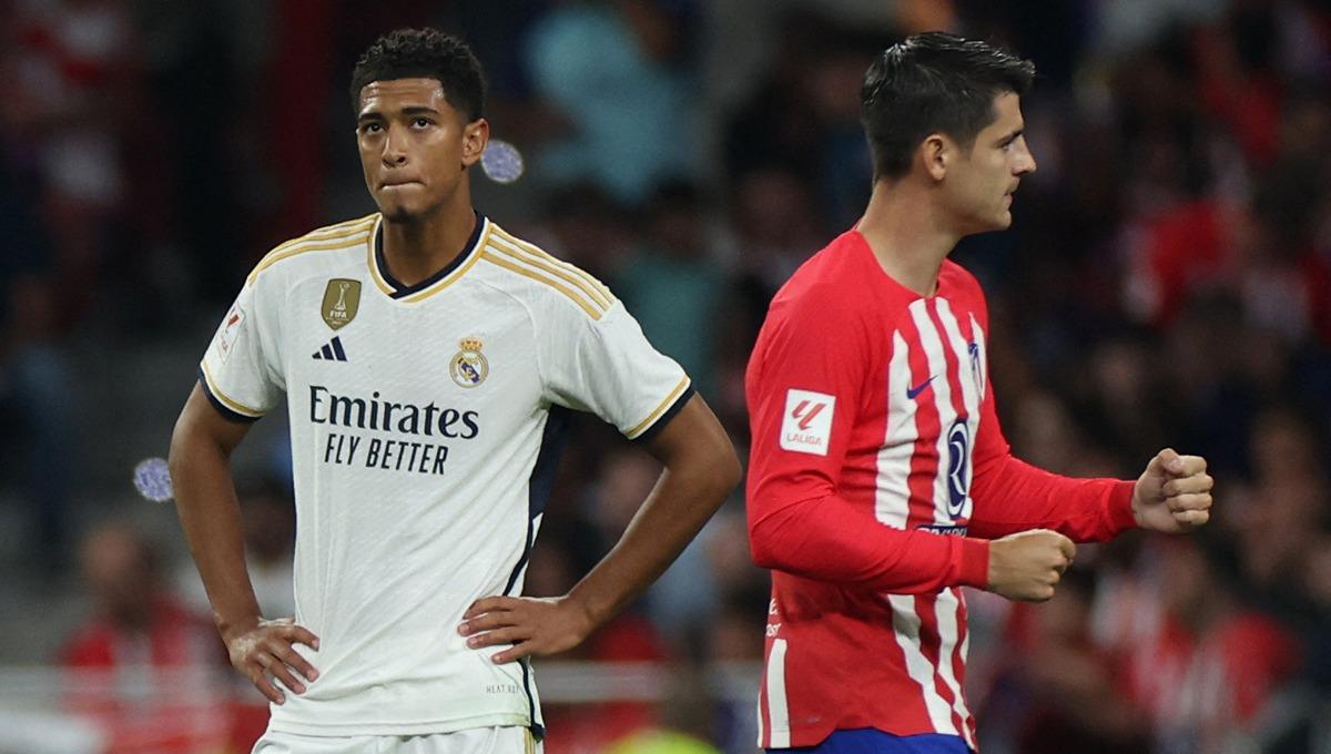 Selebrasi Alvaro Morata (kanan) di dekat Jude Bellingham pada laga Atletico Madrid vs Real Madrid (25/09/23). (Foto: REUTERS/Isabel Infantes)