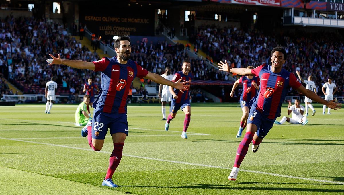 Selebrasi Ilkay Gundogan (kiri) di laga Barcelona vs Real Madrid. (Foto: REUTERS/Albert Gea) - INDOSPORT
