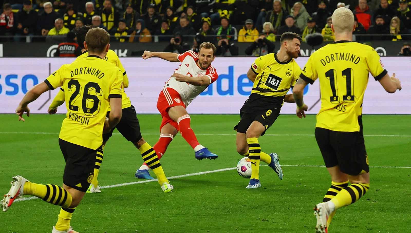 Harry Kane melepaskan tendangan keras ke gawang Borussia Dortmund pada laga Bundesliga Jerman di Stadion Signal Iduna Park. (Foto: REUTERS/Wolfgang Rattay)