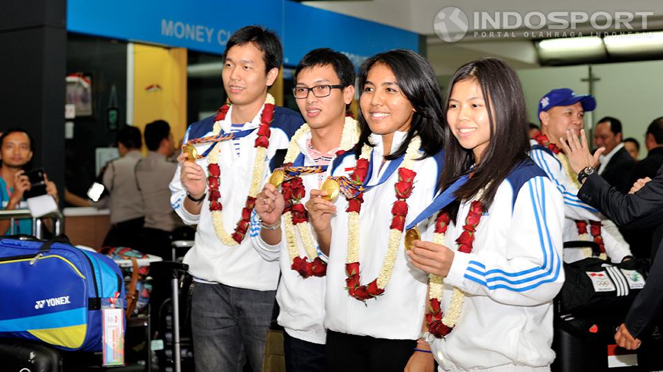 Peraih medali emas Indonesia dari cabang bulutangkis di Asian Games 2014 tiba di Bandara Internasional Soekarno Hatta, Cengkareng, Selasa (30/09/14).