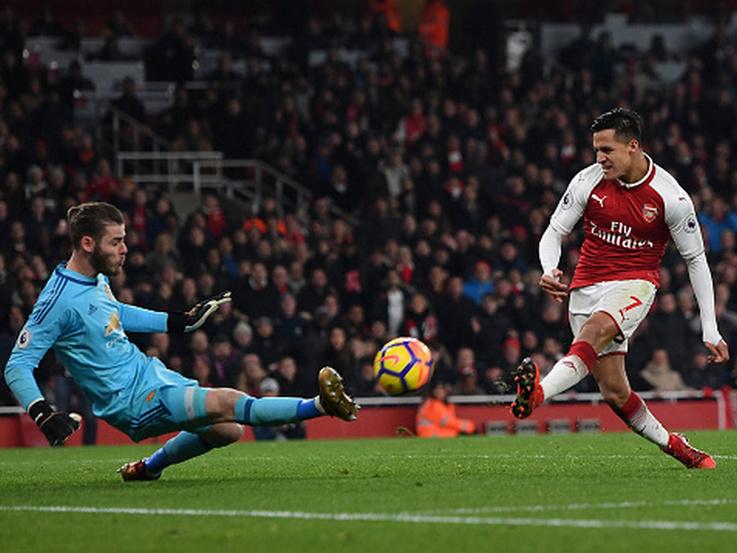 David De Gea saat melakukan penyelamatan krusial dari Sanchez. Copyright: INDOSPORT