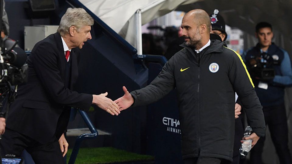 Mantan pelatih Arsenal, Arsene Wenger (kiri) dan pelatih Man City, Pep guardiola. Copyright: © Michael Regan/Getty Images