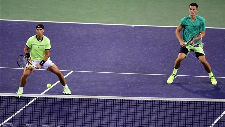 Rafael Nadal dan Bernard Tomic. Copyright: © AFP
