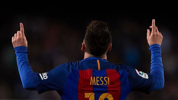 Lionel Messi kala merayakn golnya ke gawang Valencia. Copyright: © Manuel Queimadelos Alonso/Getty Images