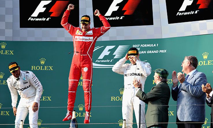 Pembalap Ferrari, Sebastian Vettel merayakan keberhasilan meraih gelar juara GP Australia. Copyright: © Mark Thompson/Getty Images