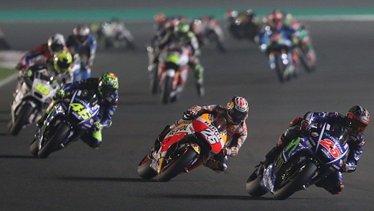 Maverick Vinales (depan) Marc Marquez (tengah) dan Valentino Rossi. Copyright: &copy; KARIM JAAFAR/AFP/Getty Images