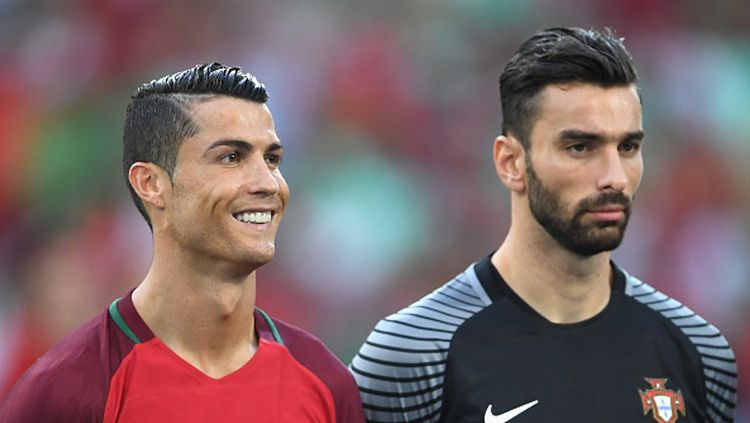 Rui Patricio (kanan) bersama Cristiano Ronaldo. Copyright: © Laurence Griffiths/Getty Images